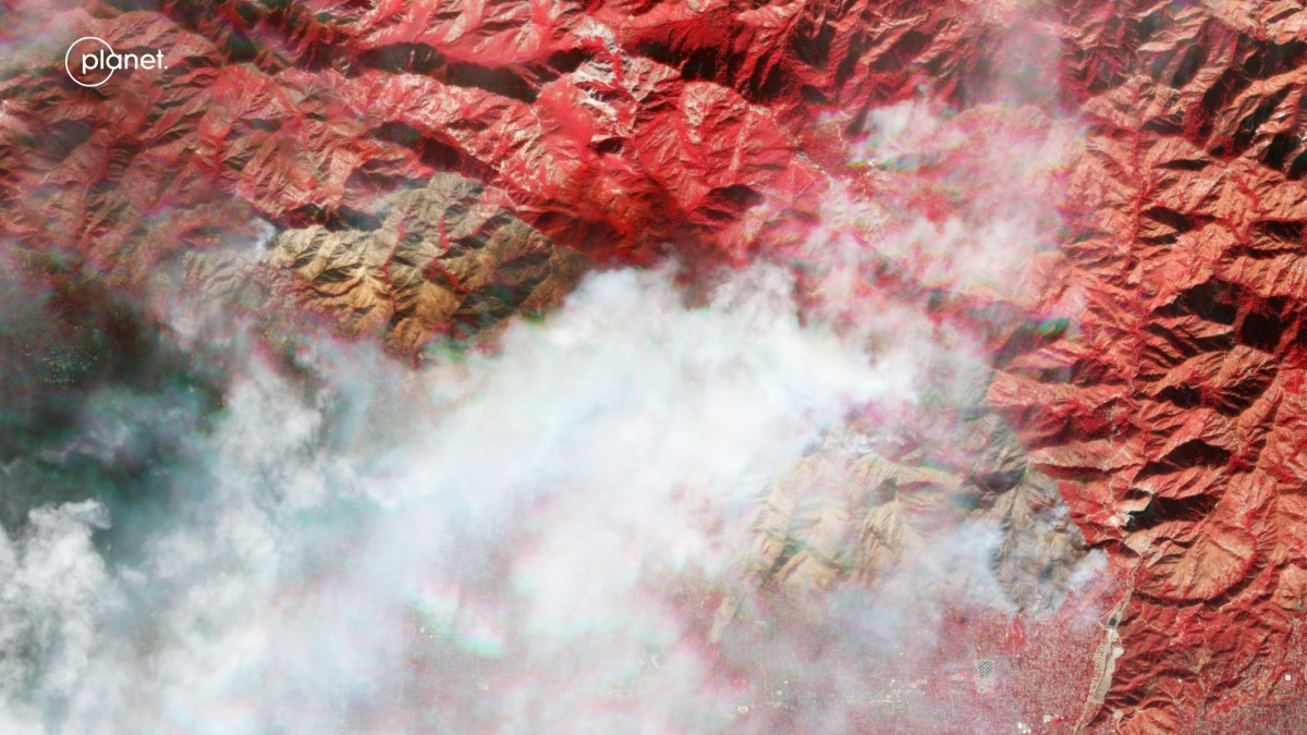 False color (Near-infrared, red, green) satellite image taken Jan. 8 of the Eaton Fire in Los Angeles County, California. Credit: Planet Labs PBC